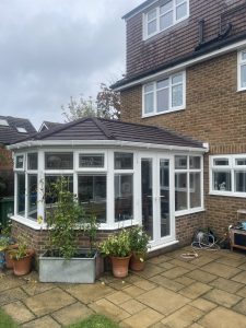Victorian Conservatory with Solid Tiled Roof and Decorative Glass