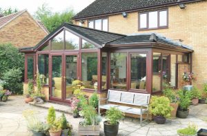 T-Shaped Conservatory with Solid Tiled Roof